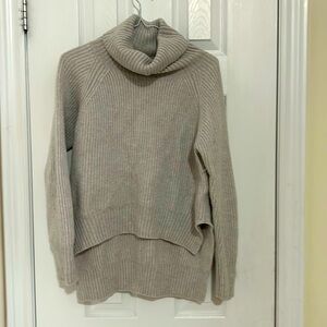 Wilfred free 100 percent merino wool long at back short at front. Very heavy